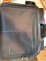 Front of black nylon laptop briefcase with red trim
