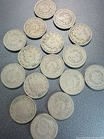 Group of 17 Liberty Head nickels spread out showing obverse and reverse sides