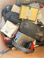 Mixed items including Magnavox device, ear muffs, small boxed accessories