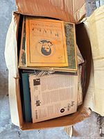 Open box showing numerous LPs topped by Elvis double-set