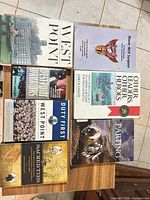 Six books laid out: West Point; None Will Surpass; Other Leaders Other Heroes; Duty First; Sacred Ties; The Parting