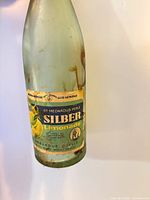 Front of St. Medardus-Perle Silber Limonade bottle showing full label and light-green glass