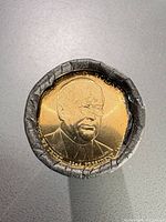 End view of US Mint roll showing Franklin D. Roosevelt obverse $1 coin