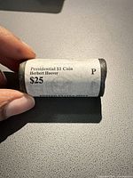 Full view of label on mint roll indicating Presidential $1 Coin Herbert Hoover $25 and P mint.