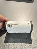 Bank-wrapped roll displaying label details: denomination, president, mint mark, face value