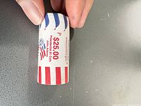 U.S. Mint wrapper side showing $25 Presidential $1 Coin text