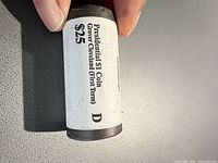 Roll showing label with president name, denomination, mint mark D