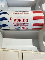 Paper-wrapped roll printed with denomination, subject and mint mark