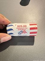 Roll showing $25.00 Presidential $1 Coin James Monroe text with P mint mark