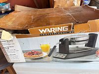 Damaged retail box for Waring Professional Quality rotating waffle maker