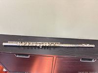 Full assembled flute on surface