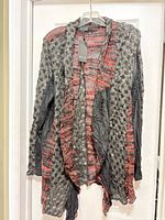 Front view of Bella grey/red open-front cardigan on hanger