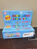 Front view of two sealed Booriss DIY Loom Bands Refill Kit boxes