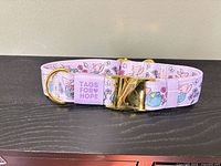 Top view of collar showing design, brand tag and gold hardware