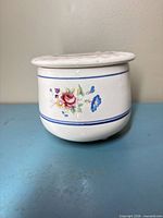 Full view of butter keeper showing floral design and blue bands