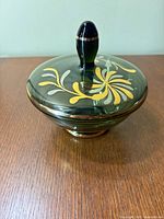 Covered candy dish with lid in place showing gilded floral design