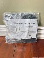 Front view of sealed package showing installation instructions sheet inside