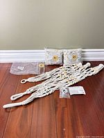 All three packs opened to show bundled hangers, hardware and packaging