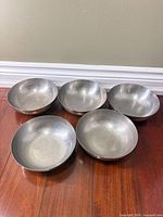 All five stainless steel bowls displayed topside