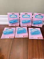 Front view of six packaged Water Wiggler toys