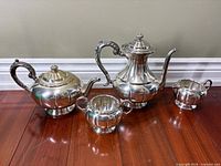 Full view of all four Supremacy Plate silver-plated pieces