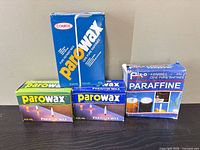 All four unopened boxes of paraffin wax displayed together