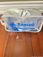 Front view of sealed Senvok carrying pouch showing branding