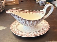 Overall view of gravy boat attached to underplate