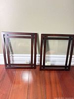 Front view of both Umbra frames standing against wall