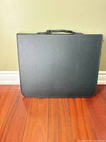 Front view of closed black portfolio case