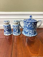 Front view of entire three-piece porcelain set
