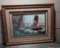 Front view of framed print showing woman and dog image, mat and frame