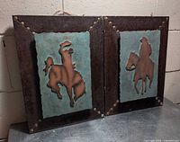 Both metal wall art pieces front view