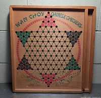 Full view of Wan Choy wooden Chinese Checkers board showing design and marble channel