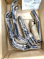 Chrome header pipes in box showing unused condition