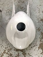 Top view of white fibreglass fuel tank cover with filler opening