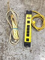 Two power bars side by side on floor