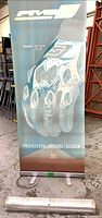 Assembled retractable banner stand showing Five motorcycle gloves graphic