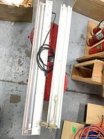 Both fixtures laid side by side showing full length and LED tubes installed