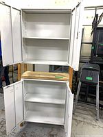 Front view showing both upper and lower cabinets open revealing shelves