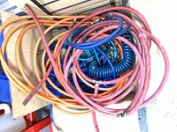 Box containing multiple coloured airline hoses