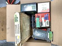 Overview of assorted filter boxes and pod filter inside a carton