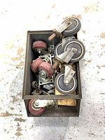 Mixed casters inside metal bin
