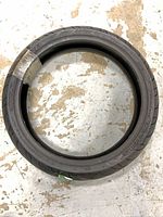 Full view of the unused tire showing overall condition