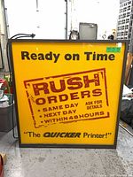 Front view displaying yellow plexiglass graphic panel