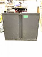 Front view of metal cabinet with closed doors