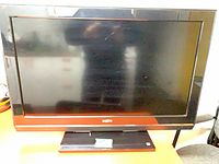 Front view of Sanyo 32" LCD TV on stand