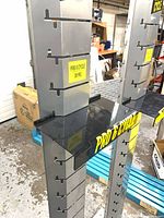 close-up of shelf mounted on tower with branding