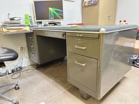 Front and right side view showing two-drawer pedestal and slide-out shelf