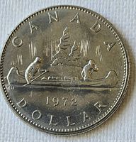 Reverse side showing canoe Voyageur design and 1972 date